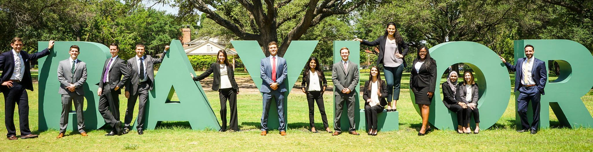 Healthcare MBA students in front of a Baylor sign