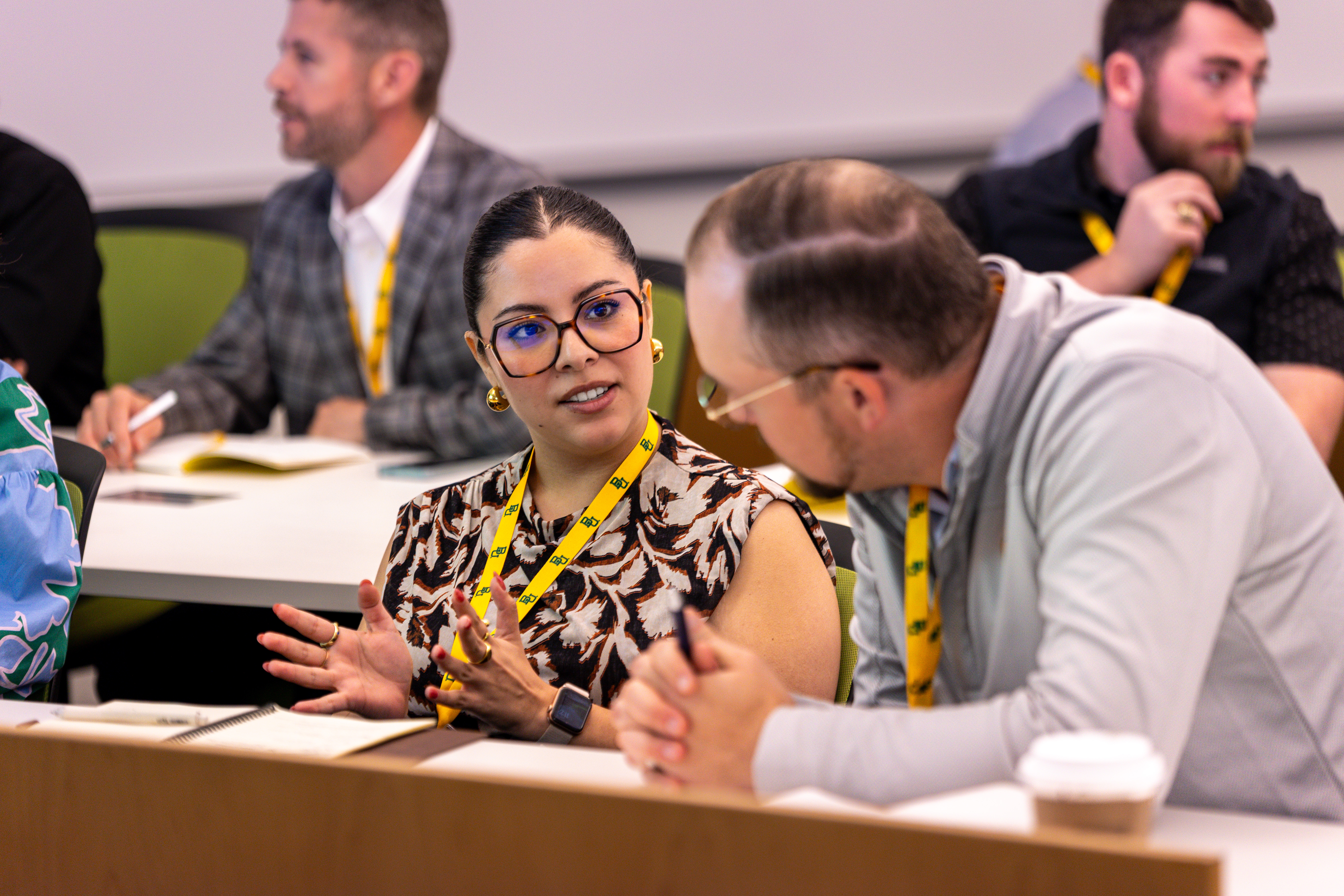 Attendees discuss the breakout material at the Armes Summit