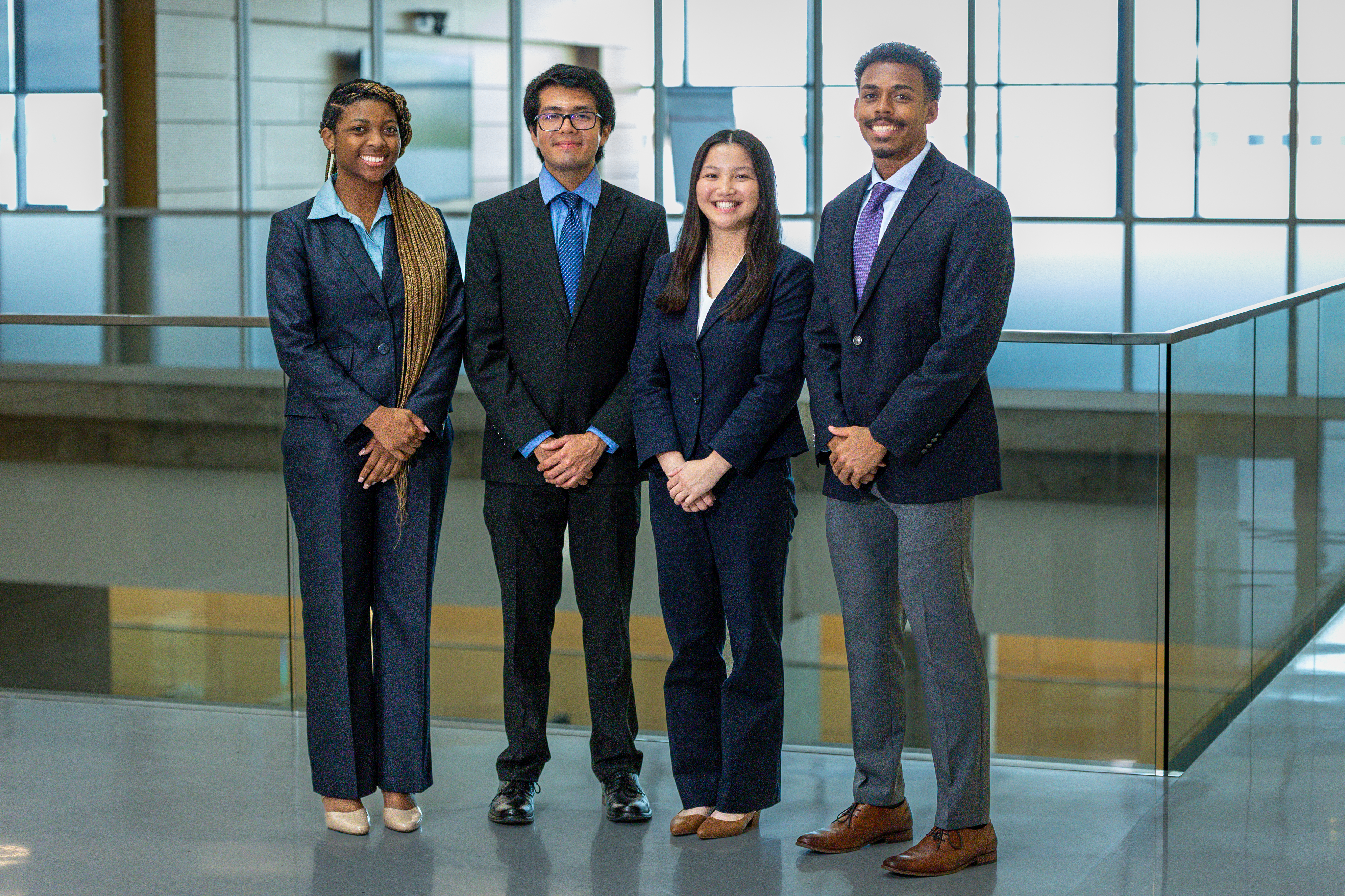 Four Baylor MBA student winners of the CASE competition smiling