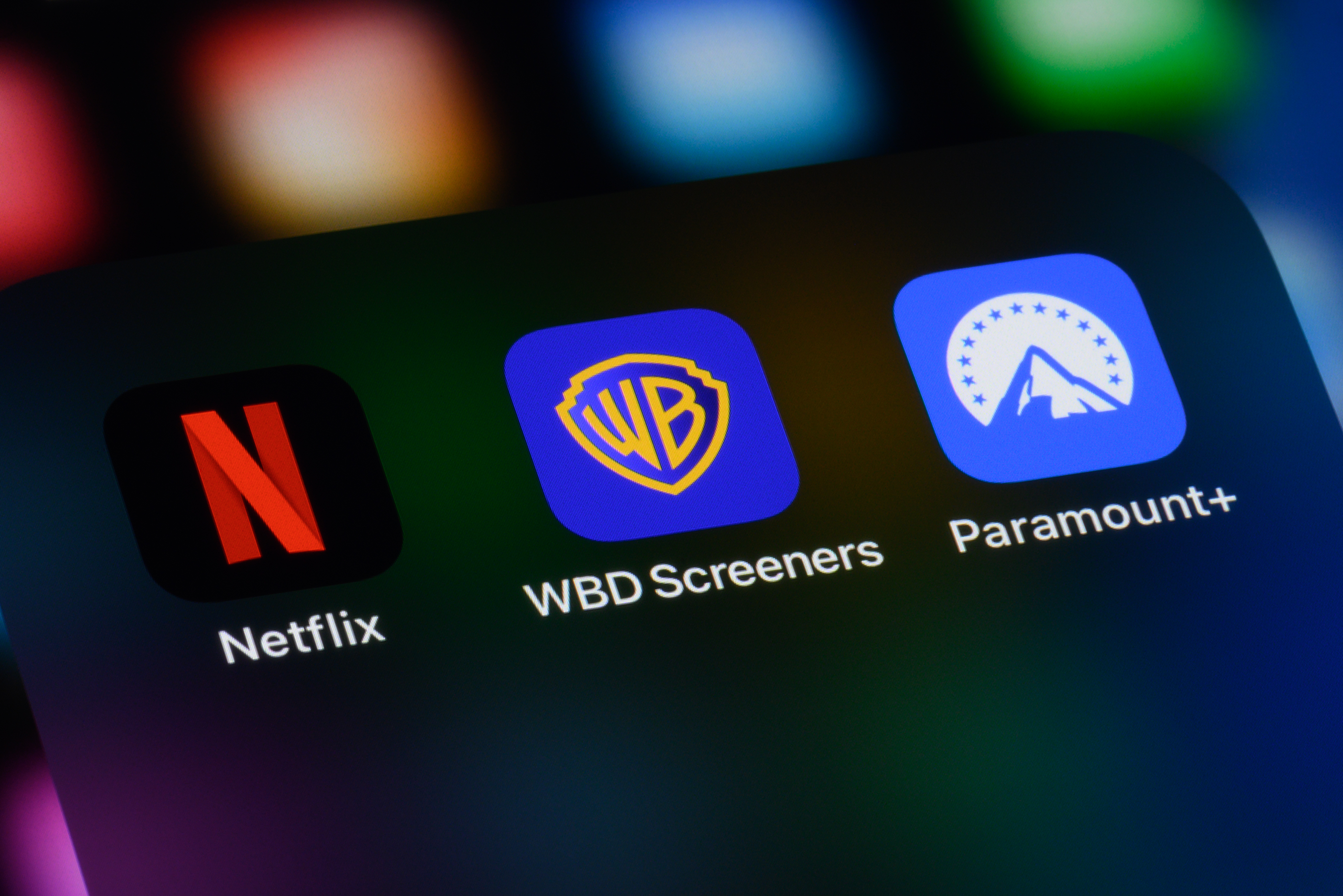 Netflix - Warner Bros. - Paramount logos on an ipad screen