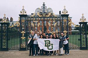 a group of people with Baylor banner