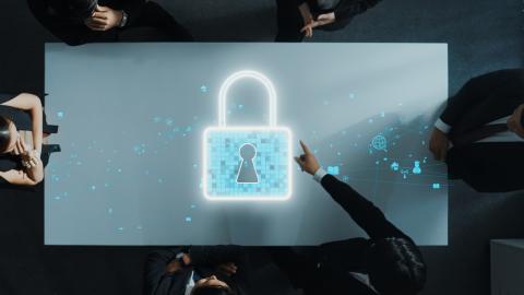 Digital padlock with a man's hand pointing to it