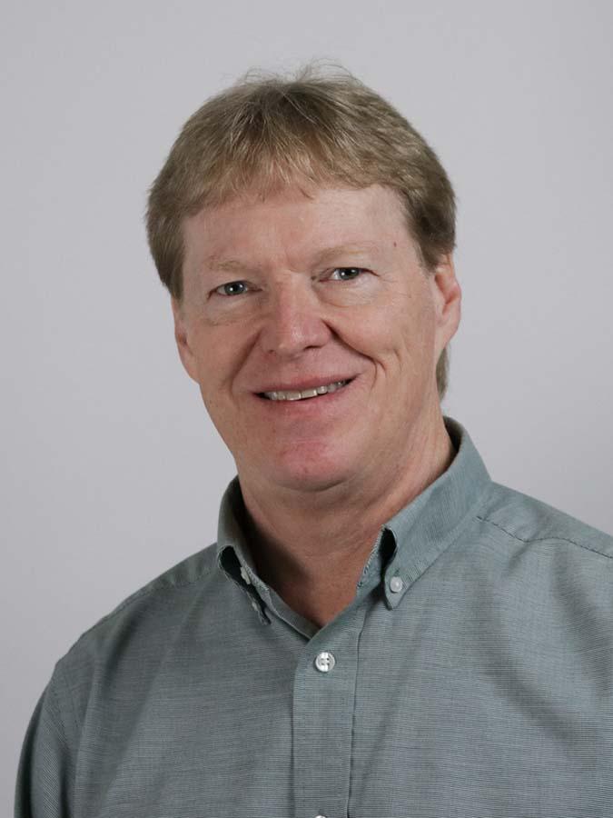 Headshot of Drew Risinger