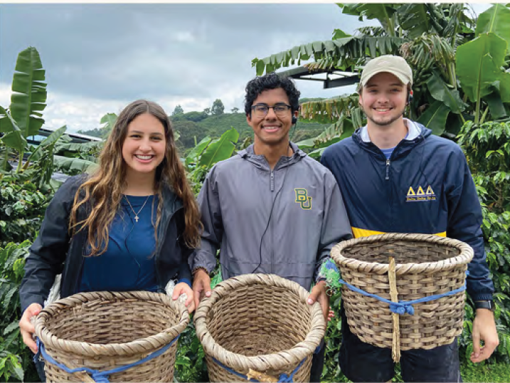 3 Baylor students smiling at Starbucks coffee farm in Costa Rica