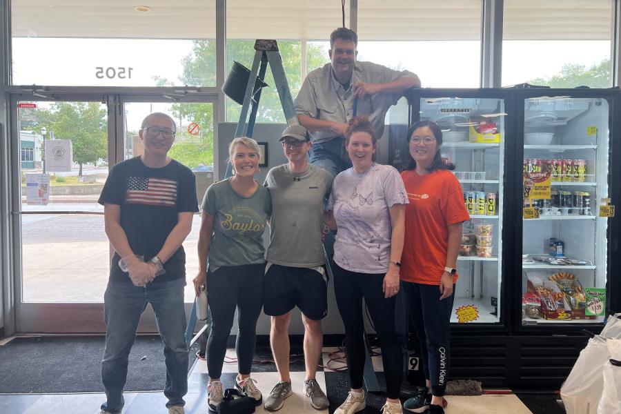 Management faculty members participate in a service project