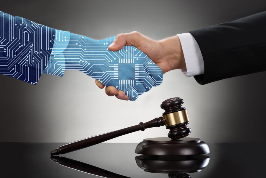 A digital hand shaking a human hand with a judge's gavel in the background
